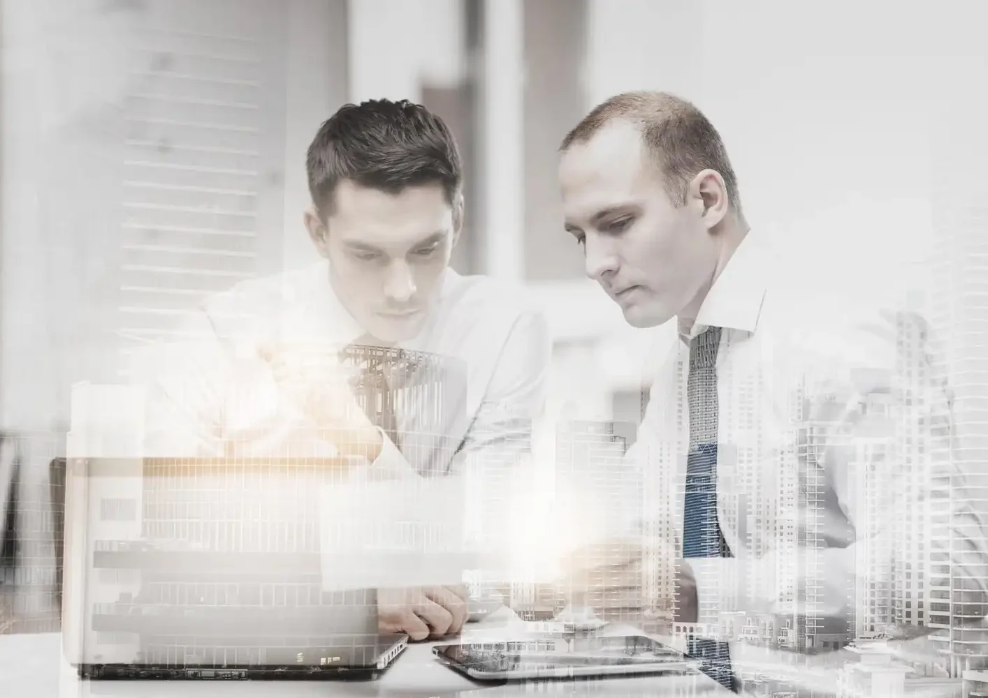 G&R Solutions IT team during discovery phase analyzing project requirements and system data using laptops for structured planning and transparency